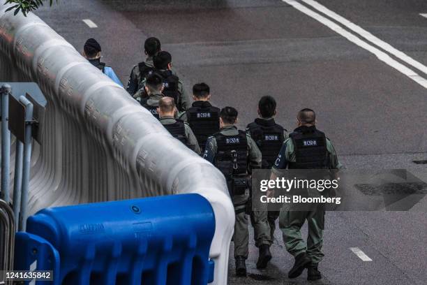 Police officers near the Convention and Exhibition Center, where President Xi Jinping is expected to speak on the 25th anniversary of Hong Kong's...