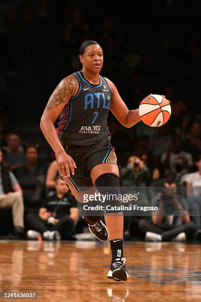 Kia Vaughn of the Atlanta Dream handles the ball during the game against the New York Liberty on June 30, 2022 at the Barclays Center in Brooklyn,...