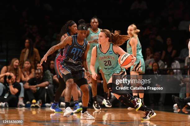 Sabrina Ionescu of the New York Liberty handles the ball during the game against the Atlanta Dream on June 30, 2022 at the Barclays Center in...