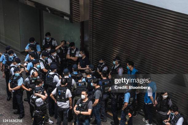 Police officers near the Convention and Exhibition Center, where President Xi Jinping is expected to speak on the 25th anniversary of Hong Kong's...