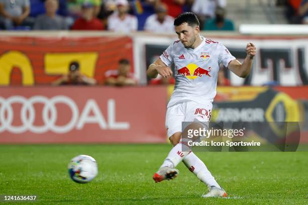 New York Red Bulls midfielder Lewis Morgan scores on a penalty kick during the second half of the Major League Soccer game between the New York Red...