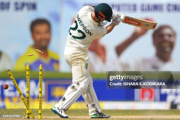 Australia's Mitchell Swepson's dismissal by Sri Lanka's Asitha Fernando during the third day of play of the first cricket Test match between Sri...