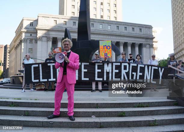 Climate activists, including members of Extinction Rebellion, participate in a demonstration in front of the Thurgood Marshall US Courthouse against...