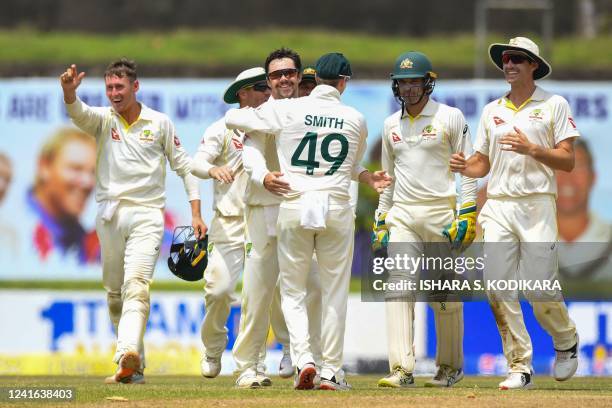 Australia's Travis Head celebrates with teammates after the dismissal of Sri Lanka's Dinesh Chandimal during the third day of first cricket Test...