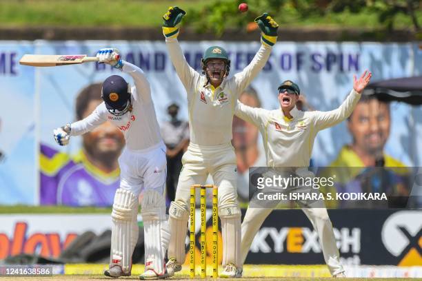 Australia's wicketkeeper Alex Carey and Steven Smith unsuccessfully appeals for a leg before wicket against Sri Lanka's Dhananjaya de Silva during...
