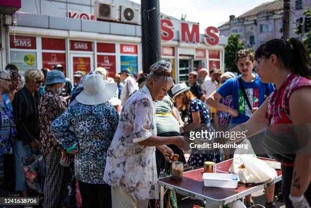 Charity distributes free food and lunch for those in need at a market in Kryvyi Rih, Ukraine, on Tuesday, June 28, 2022. More than four months after...