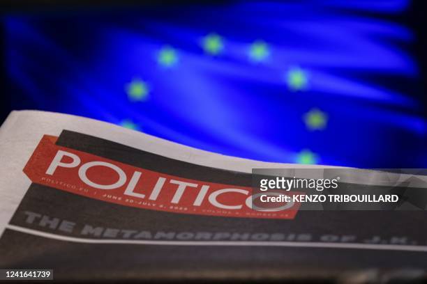 Picture taken on July 1, 2022 in Brussels shows the frontpage of "Politico" newspaper with the European Union flag in the background.