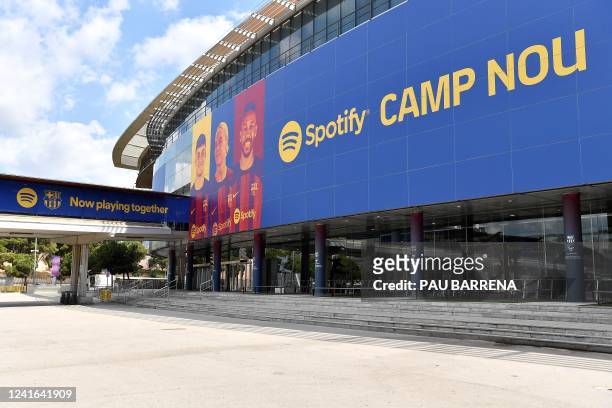 This photograph taken on July 1, 2022 shows the logo of Spotify Technology S.A on the banner at the entrance of the Camp Nou stadium in Barcelona.