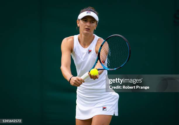 Irina-Camelia Begu of Romania in action against Jelena Ostapenko of Latvia in her third round match during Day Five of The Championships Wimbledon...