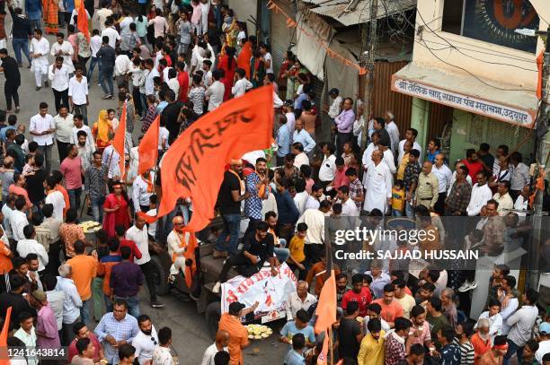 Hindu devotees take part in Jagannath Rath Yatra religious procession outside the Jagdish Temple in Udaipur on July 1, 2022.