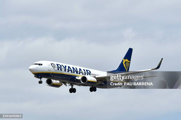 Ryanair Boeing 737-8AS aircraft lands at El Prat airport in Barcelona on July 1, 2022. Nine flights to and from Spain were cancelled on July 1 and...