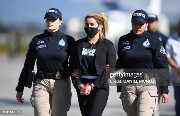 Nini Johana Usuga , sister of Colombian drug lord Dairo Antonio Usuga, alias 'Otoniel', is escorted by Interpol police officers before being...