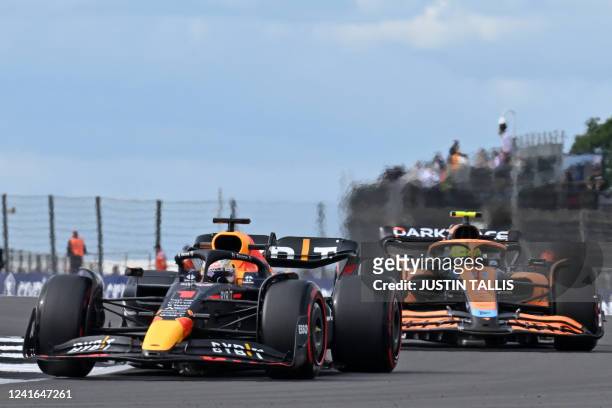 Red Bull Racing's Dutch driver Max Verstappen and McLaren's British driver Lando Norris drive during second practice ahead of the Formula One British...