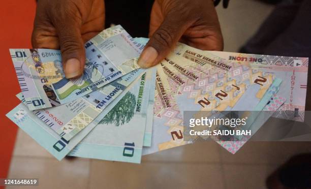 General view of the new banknotes released in Sierra Leone on July 1, 2022. Sierra Leone on July 1, 2022 introduced a new family of banknotes,...