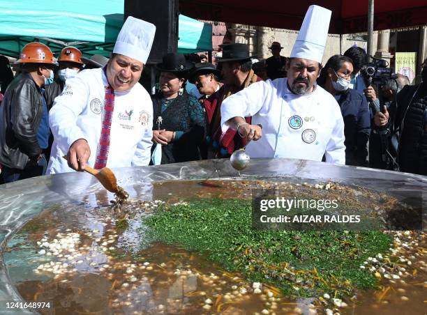 Chefs prepare Bolivia's largest dish of chairo, a traditional soup of the Aymara people based mainly on vegetables and dried lamb meat, at San...