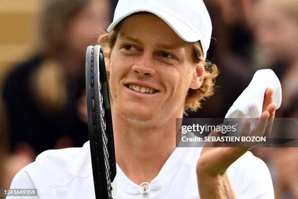 Italy's Jannik Sinner celebrates beating US player John Isner during their men's singles tennis match on the fifth day of the 2022 Wimbledon...