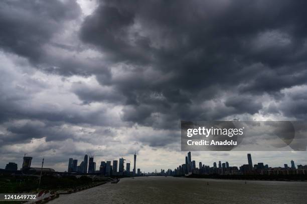 View of the Guangzhou CBD under dark clouds on July 1, 2022 in Guangzhou, Guangdong Province of China.Typhoon Xianba is expected to land along the...