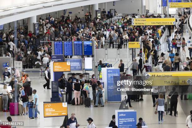 Travelers at John F. Kennedy International Airport in the Queens borough of New York, US, on Friday, July 1, 2022. As travel is ramping up for the...