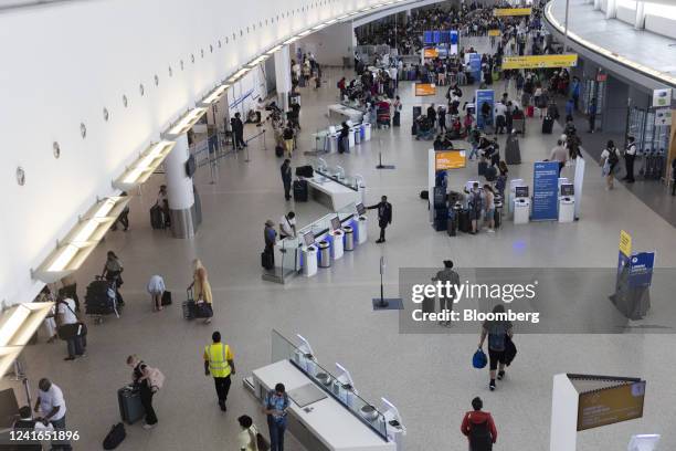 Travelers at John F. Kennedy International Airport in the Queens borough of New York, US, on Friday, July 1, 2022. As travel is ramping up for the...