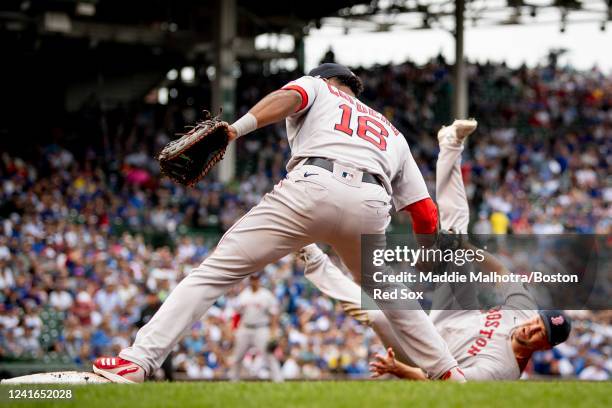 Rich Hill of the Boston Red Sox flips the ball to Franchy Cordero of the Boston Red Sox for an out a first base during the third inning of a game...