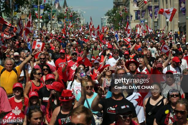 Hundreds of "Freedom Convoy" supporters march in downtown Ottawa on Canada Day July 1, 2022 in Ottawa, Canada. - The so-called "Freedom Convoy,"...