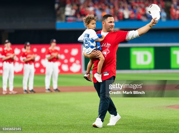 Former catcher and and Canadian baseball player Russell Martin is honored on the field for his retirement on Canada Day before the Tampa Bay Rays...