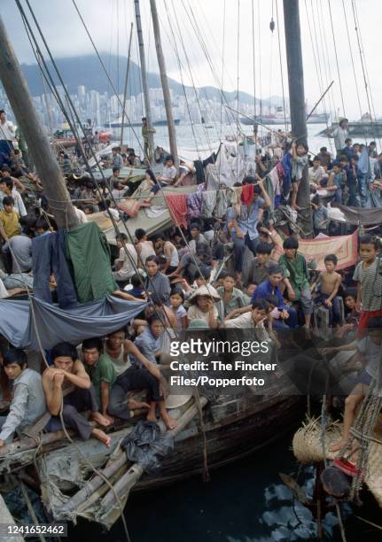 Thousands of Vietnamese refugees known as the "boat people" seen cramped in ships moored off the Port of Hong Kong where they were kept isolated and...