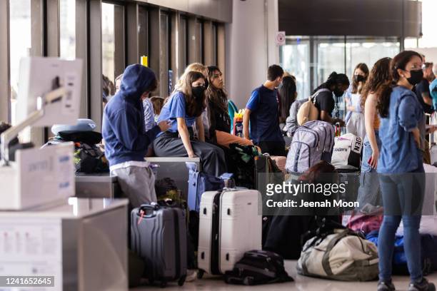 Travelers wait at Newark Liberty International Airport on July 1, 2022 in Newark, New Jersey. Hundreds of flights were canceled across the US ahead...
