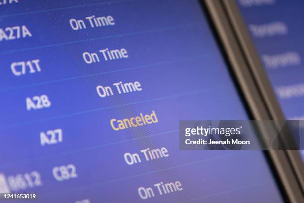 Canceled flight is seen on a departures board at Newark Liberty International Airport on July 1, 2022 in Newark, New Jersey. Hundreds of flights were...
