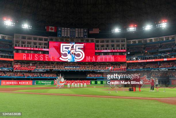 Former catcher and and Canadian baseball player Russell Martin is honored on the field for his retirement on Canada Day before the Tampa Bay Rays...