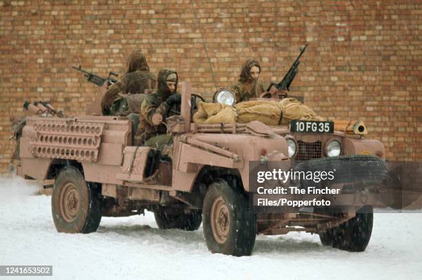 Members of the SAS, an elite special forces unit of the British Army, in an army Land Rover in the snow while on a training exercise in Hereford,...