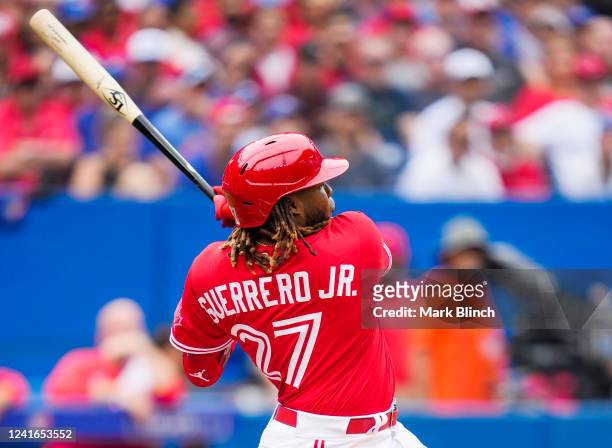Vladimir Guerrero Jr. #27 of the Toronto Blue Jays hits a two RBI double against the Tampa Bay Rays in the third inning during their MLB game at the...