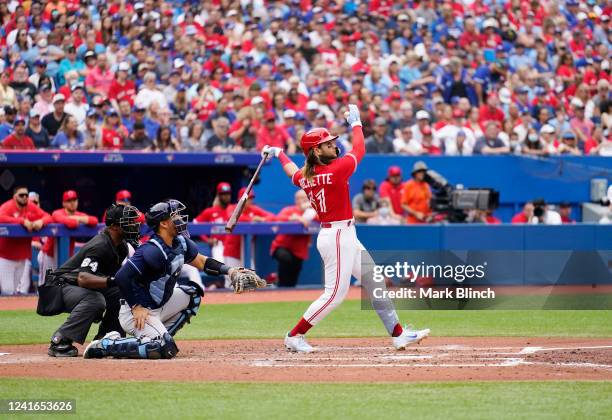 Bo Bichette of the Toronto Blue Jays hits a two RBI double against the Tampa Bay Rays in the third inning during their MLB game at the Rogers Centre...