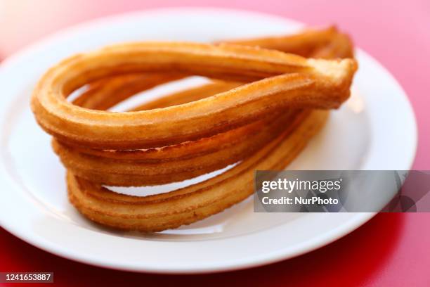 Churros are seen on a cafe table in this illustration photo taken in Madrid, Spain on July 1, 2022.