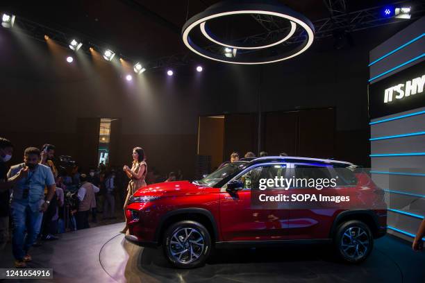 Press reporters seen around the vehicle during the launch. Toyota unveiled the new Urban Cruiser Hyryder at Hyatt Aerocity, Toyotas first...