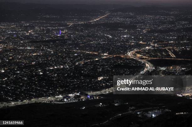 This picture taken on July 1, 2022 shows a sunset view from Mount Azmar of Iraq's northeastern city of Sulaymaniyah in the autonomous Kurdistan...