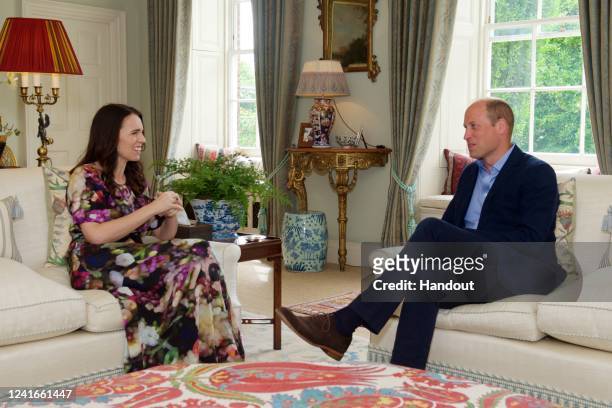 In this handout photo issued by Kensington Palace, Prince William, Duke of Cambridge meets with New Zealand Prime Minister Jacinda Ardern at...