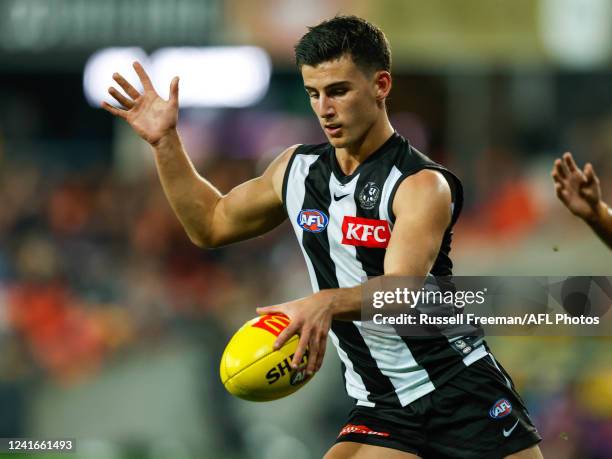 Nick Daicos of the Magpies in action during the 2022 AFL Round 16 match between the Gold Coast Suns and the Collingwood Magpies at Metricon Stadium...