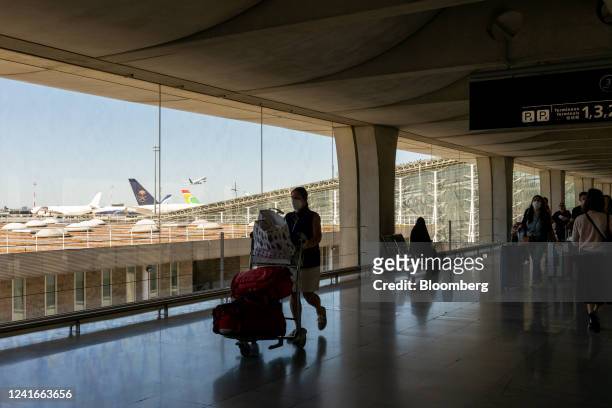 Passengers with luggage during a strike by airport workers at Charles de Gaulle airport in Paris, France, on Saturday, July 2, 2022. Traffic at...