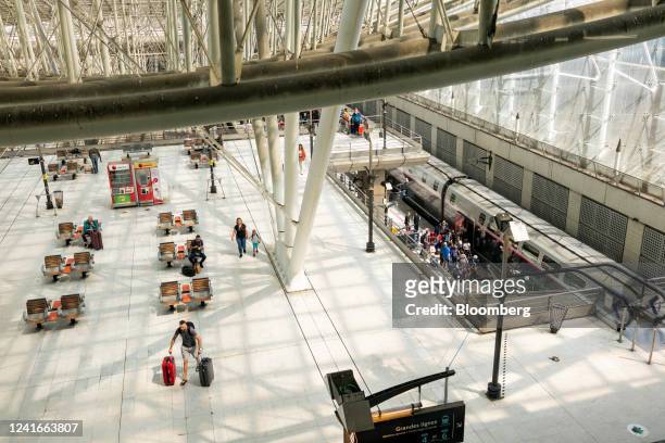 Passengers arrive by train during a strike by airport workers at Charles de Gaulle airport in Paris, France, on Saturday, July 2, 2022. Traffic at...