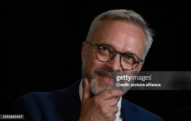 July 2022, Saxony-Anhalt, Naumburg : Leipzig artist Michael Triegel speaks at a press conference in Naumburg Cathedral about a three-winged...