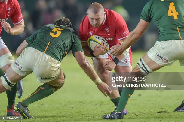 Wales' prop Dillon Lewis is tackled by South Africa's lock Lood de Jager during an international rugby union match between South Africa and Wales at...