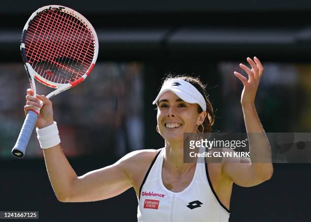 France's Alize Cornet celebrates beating Poland's Iga Swiatek during their women's singles tennis match on the sixth day of the 2022 Wimbledon...