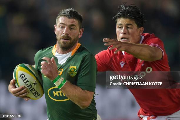 South Africa's Willie le Roux is tackled by Wales' wing Louis Rees-Zammit during an international rugby union match between South Africa and Wales at...