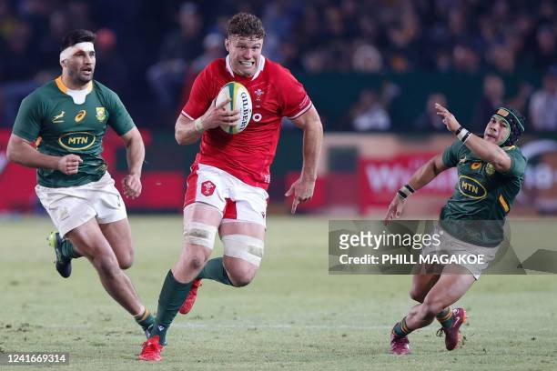 Wales' lock Will Rowlands runs with the ball during an international rugby union match between South Africa and Wales at Loftus Versfeld in Pretoria...