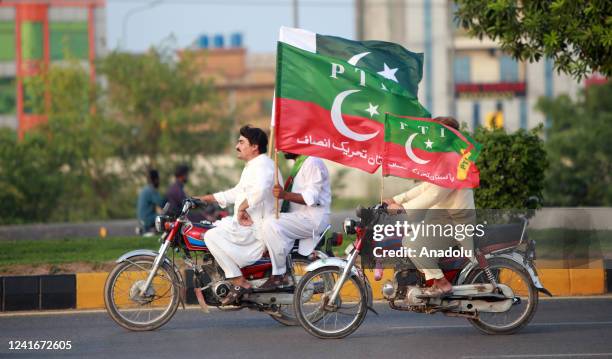 Supporters of Pakistan Tehreek-e-Insaf march towards the capital during an anti government protest in Rawalpindi, Pakistan, on July 02, 2022. Former...