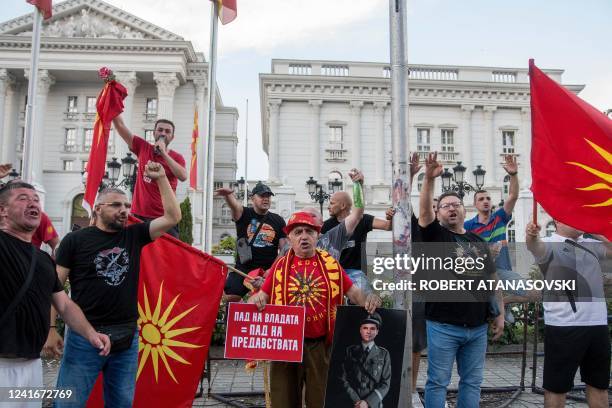 People shout slogans and wave flags during the protest in front of governamet building on under the slogan Ultimatum no thanks in Skopje on July 2,...