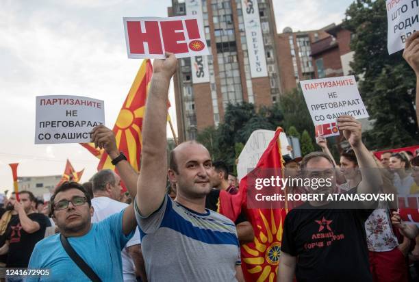 People shout slogans and wave flags during the protest in front of governamet building on under the slogan Ultimatum no thanks in Skopje on July 2,...