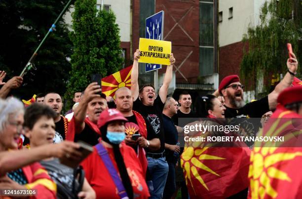 People shout slogans and wave flags during the protest in front of governamet building on under the slogan Ultimatum no thanks in Skopje on July 2,...