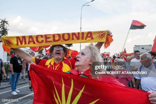 People shout slogans and wave flags during the protest in front of governamet building on under the slogan Ultimatum no thanks in Skopje on July 2,...